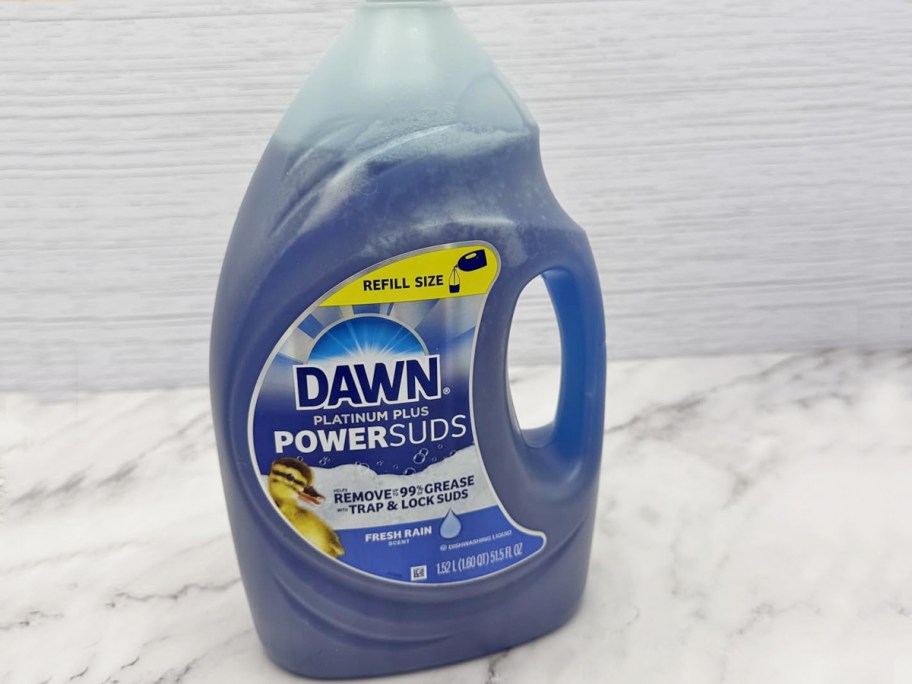 large blue refill bottle of dawn soap on counter