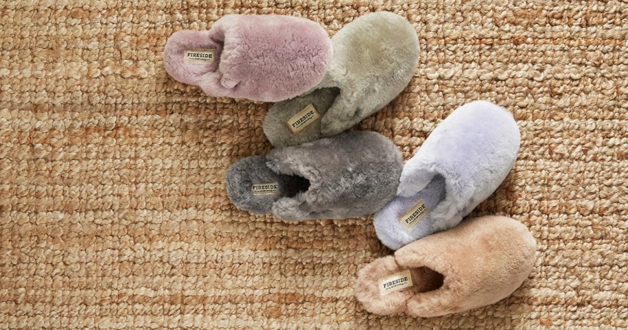 fluffy slippers in 5 different colors on brown rug