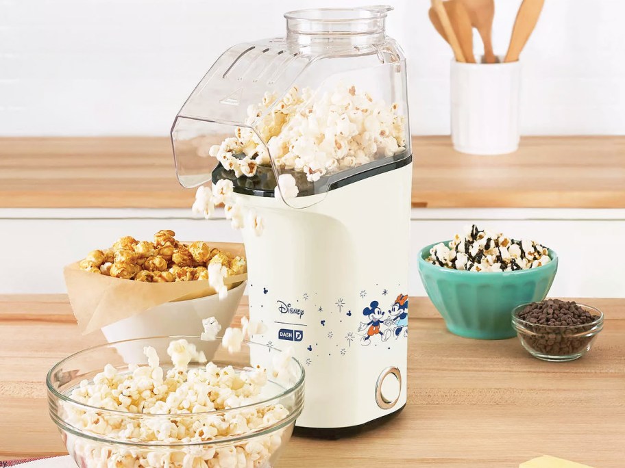 minnie & mickey mouse popcorn maker on counter