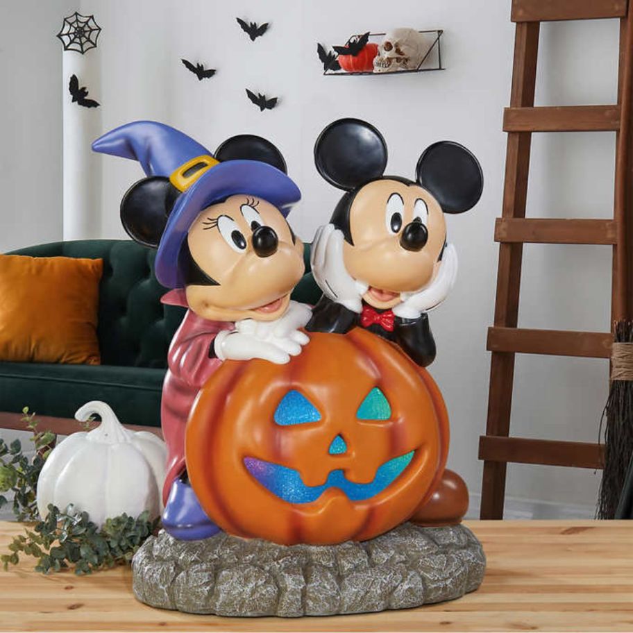 Halloween Mickey and Minnie ceramic Pumpkin Greeter on a table top