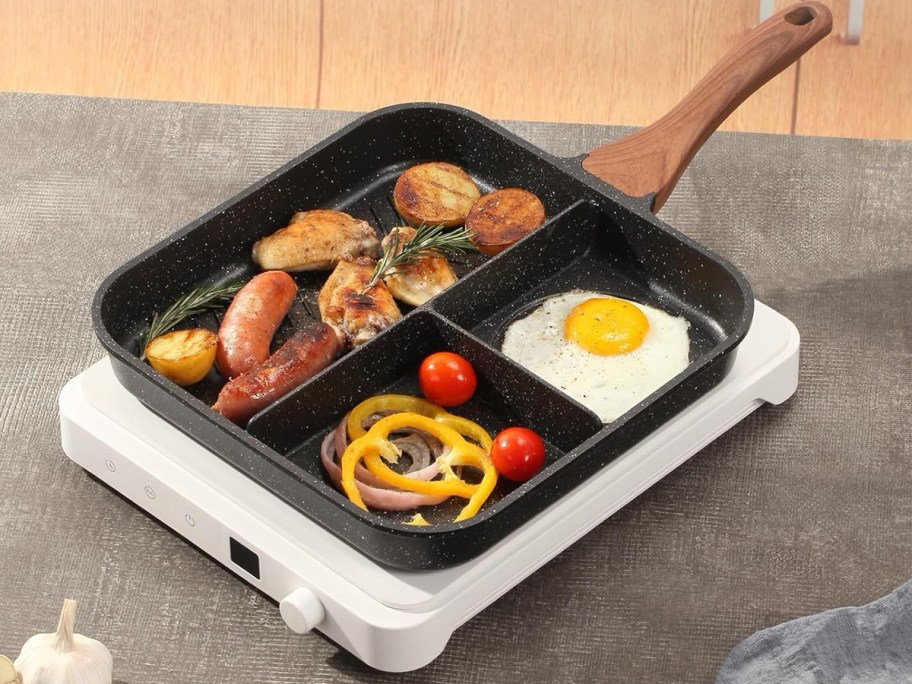 ESLITE LIFE Nonstick Divided Breakfast Grill Pan sitting on a cooktop 