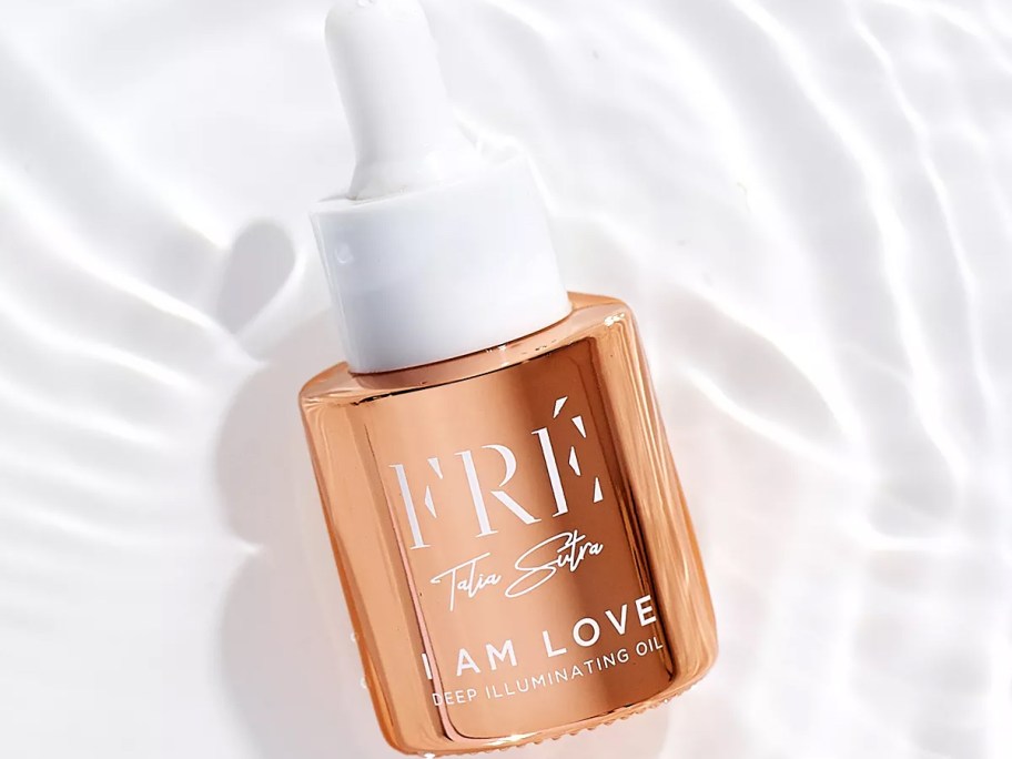 rose gold bottle of FRE I Am Love Deep Illuminating Oil