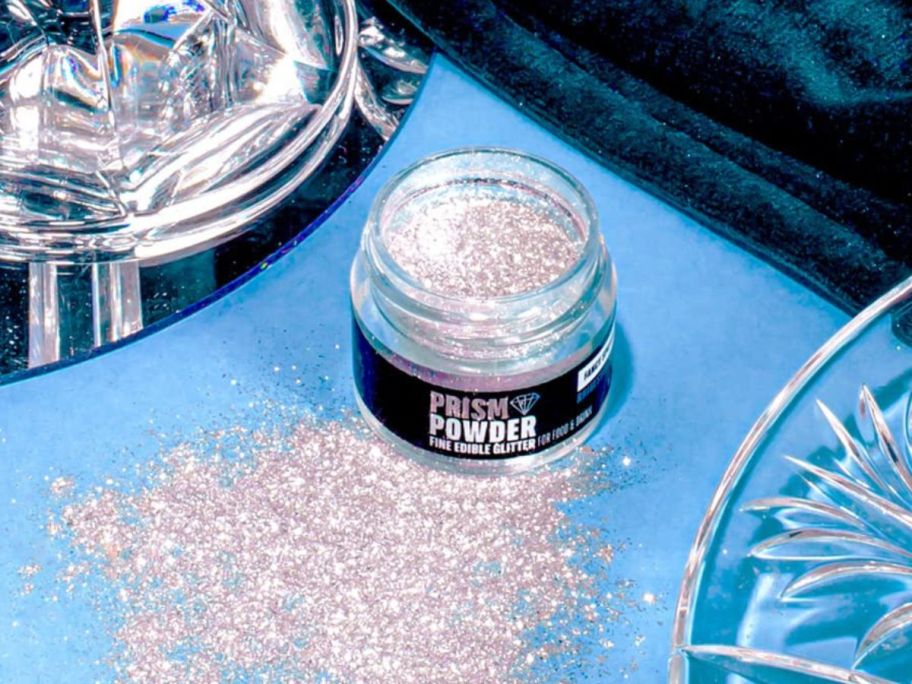 A Fancy Sprinkles Premium Edible Glitter Prism Powder on a table