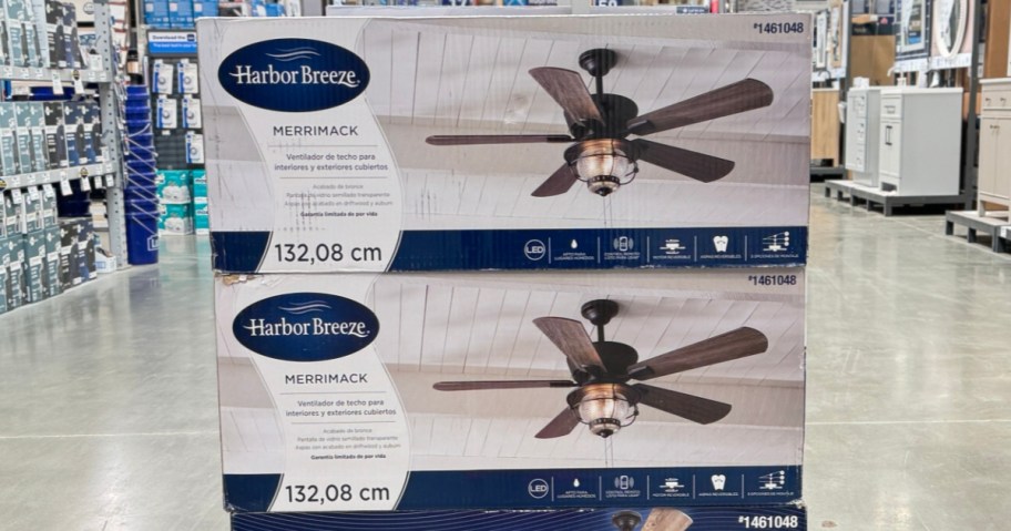 5 blade ceiling fans in box stacked in aisle at Lowe's