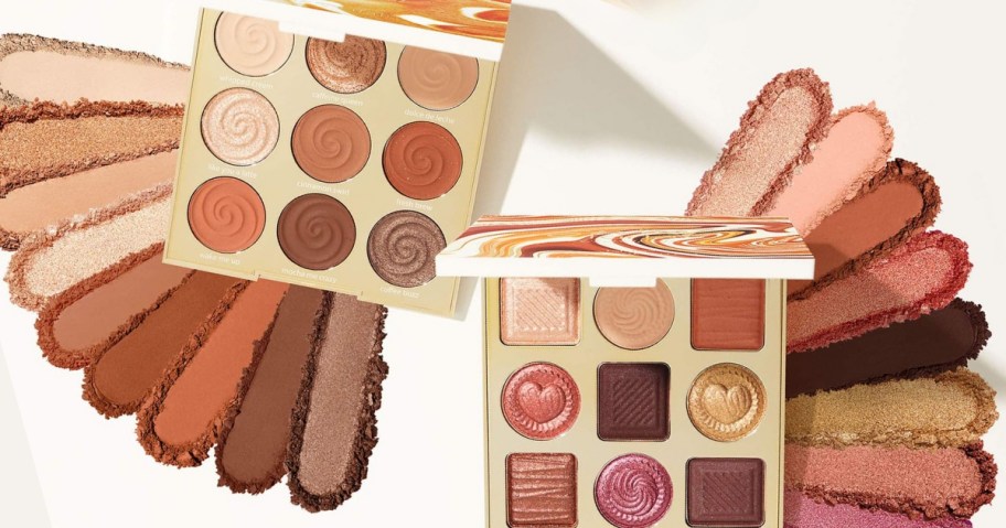 two Tarte Eyeshadow Palettes open with shadow spread out beneath them