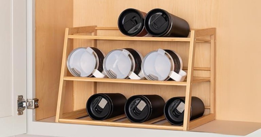 bamboo 3 tier water bottle or tumbler organizer in a cabinet