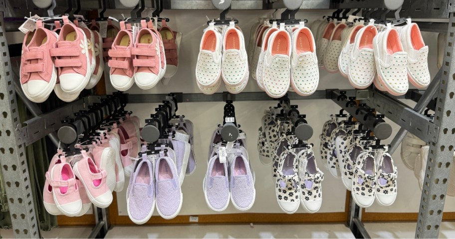 old navy kids sneakers on a wall display
