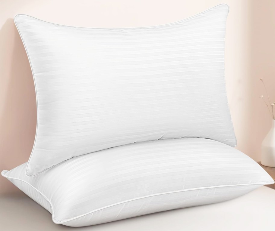 two white striped bed pillows