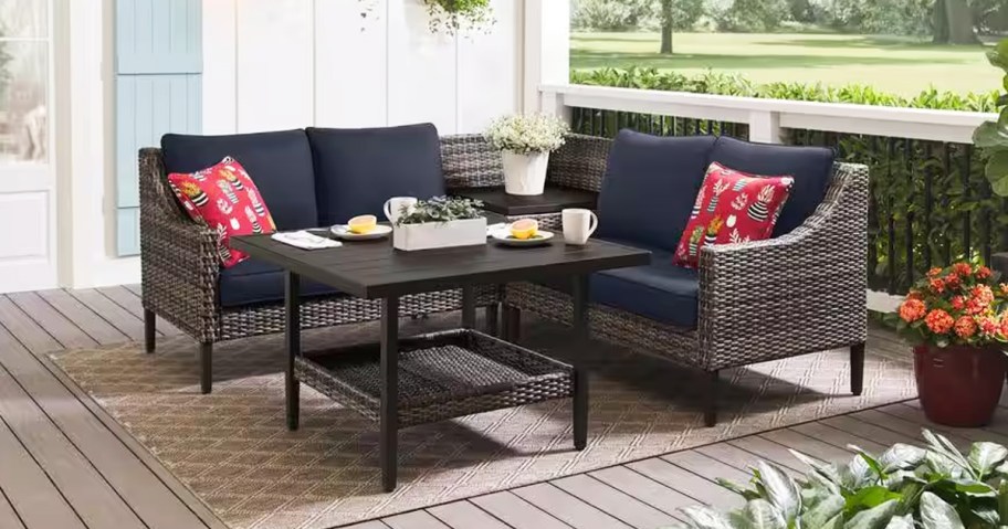 patio sectional with dark blue cushions and table