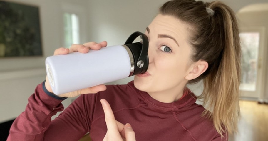 woman drinking from hydro flask wide mouth bottle with flex sip lid