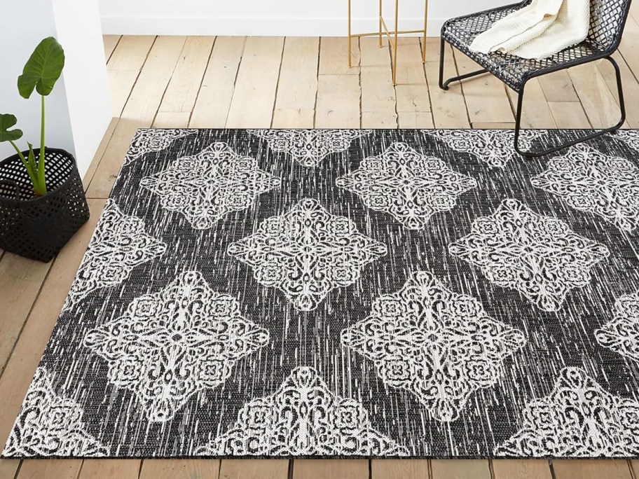 black area rug with white medallion print