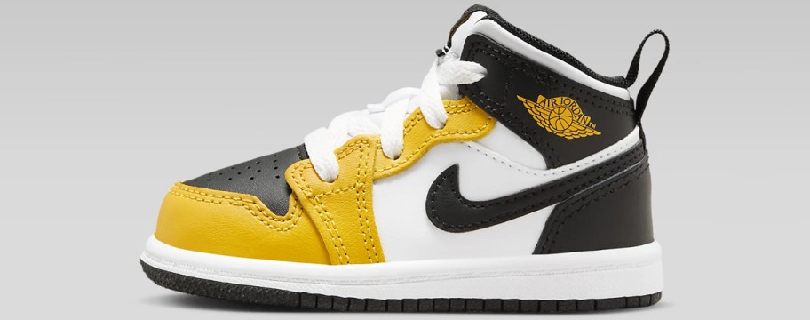black, white, and yellow jordan sneaker