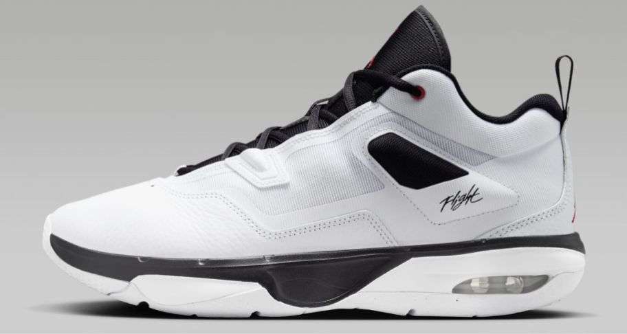 a white mens sneaker with black accents