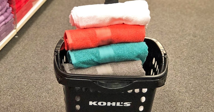 stack of folded towels in kohls shopping basket