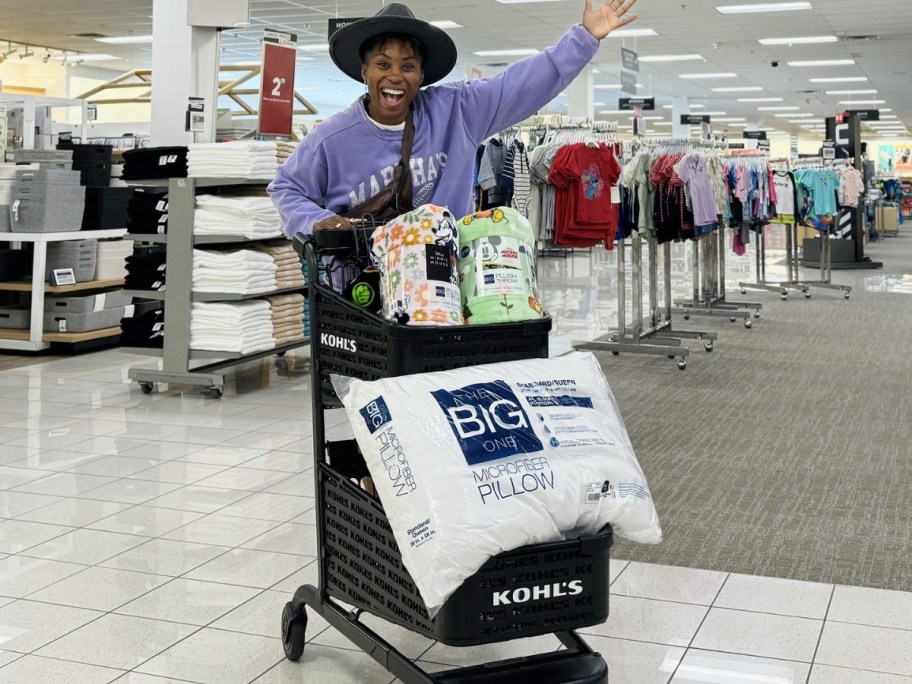 woman with kohl's shopping cart full of home goods