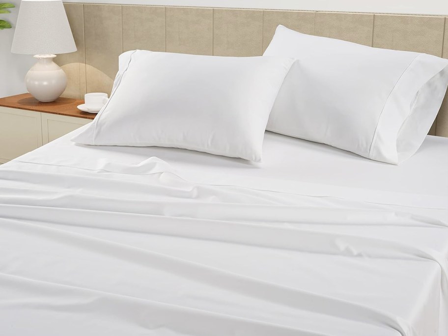 white sheet set on a bed