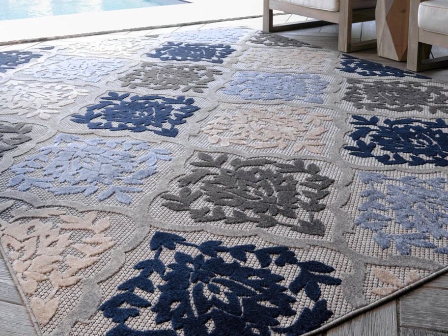blue and grey area rug on patio