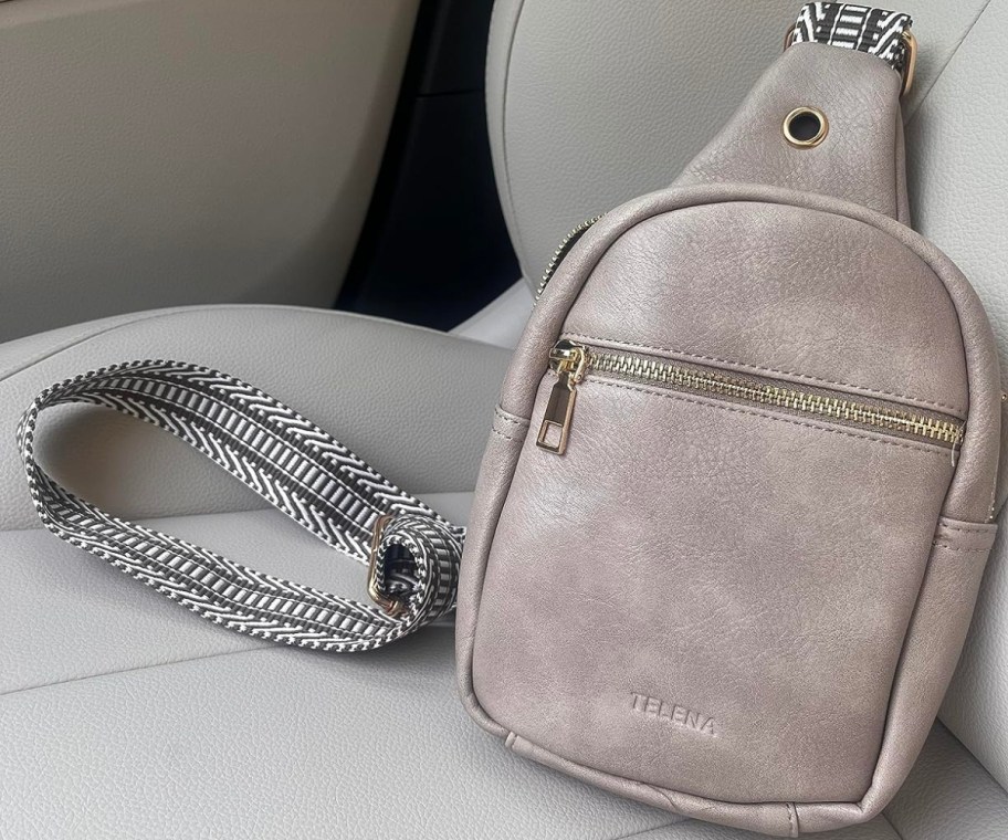 telena leather crossbody sling bag on car seat