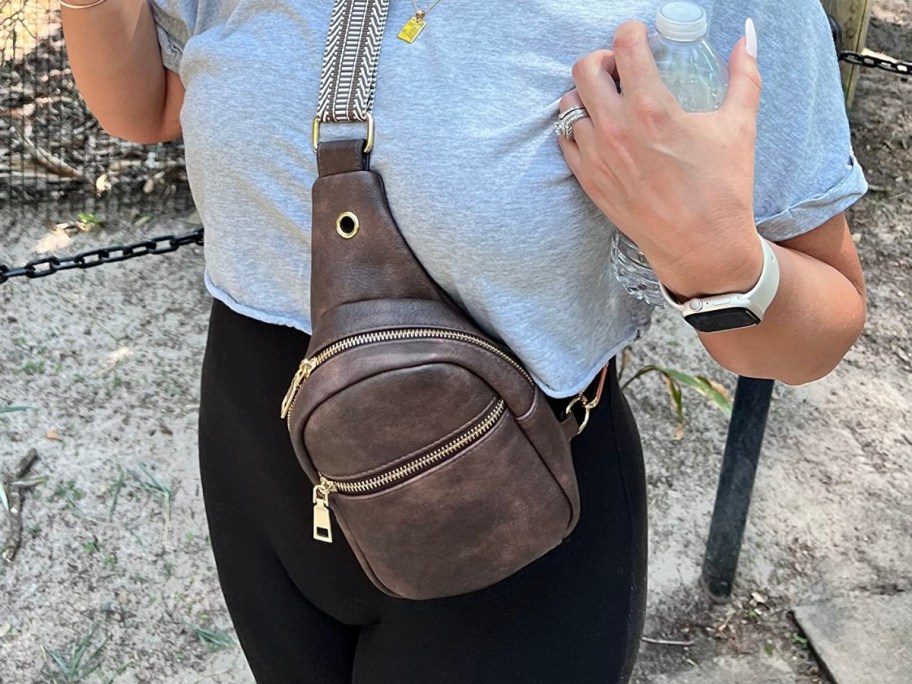 woman wearing telena leather crossbody sling bag