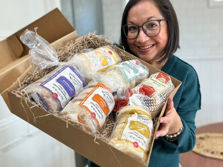 Lina holding box of english muffins