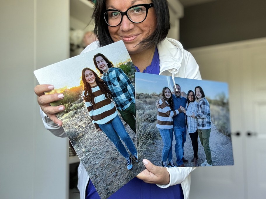 Lina holding metal images of her family