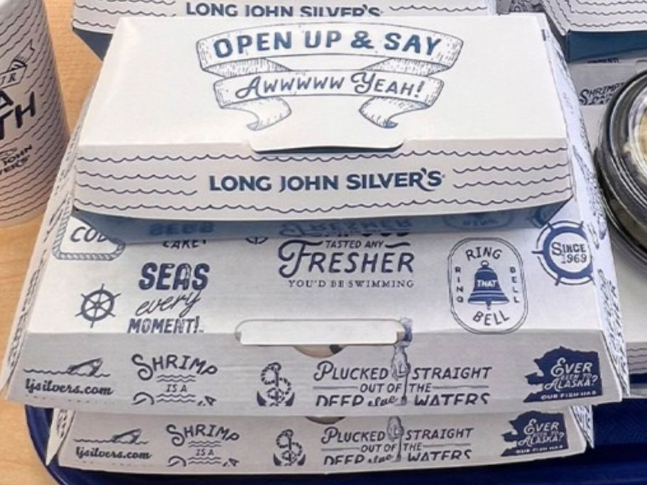A stack of Long John Silvers takeout Boxes