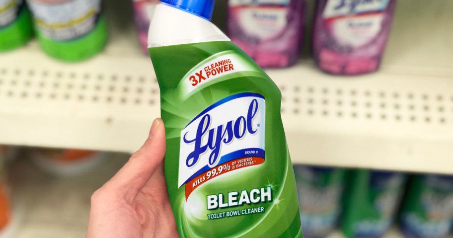 hand holding a green bottle of Lysol Toilet Bowl Cleaner with Bleach