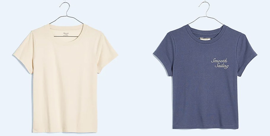 white and blue t-shirts on hangers