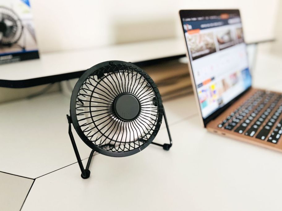 A Mainstays 4” Personal USB Powered Desktop Fan on a desk