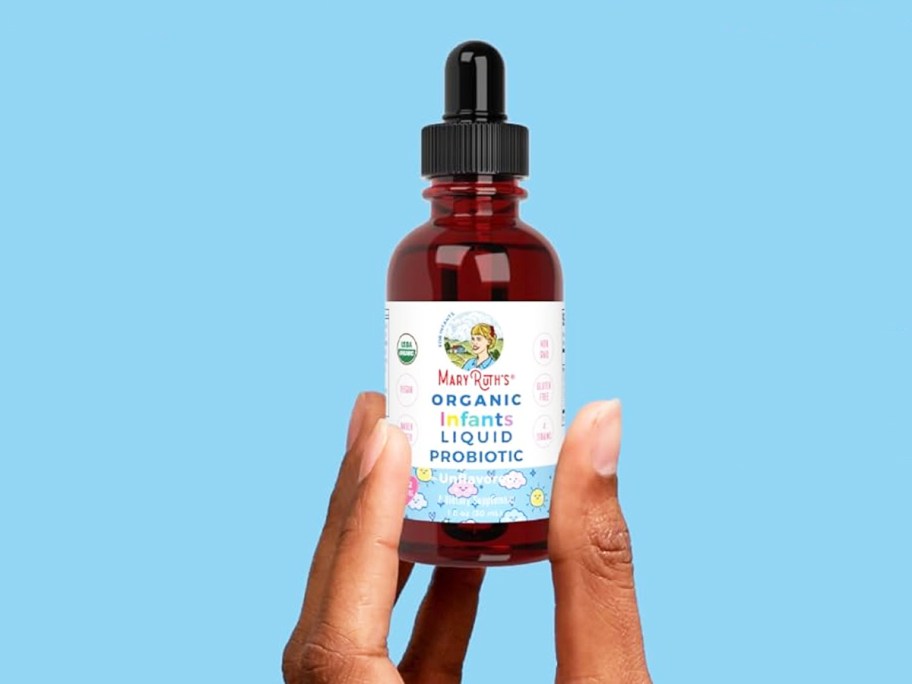 hand holding up a bottle of MaryRuth Organics Infant Liquid Probiotic Drops