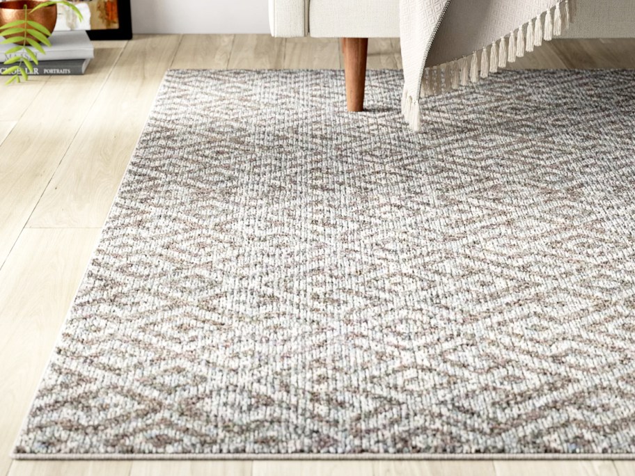 white and tan geometric area rug