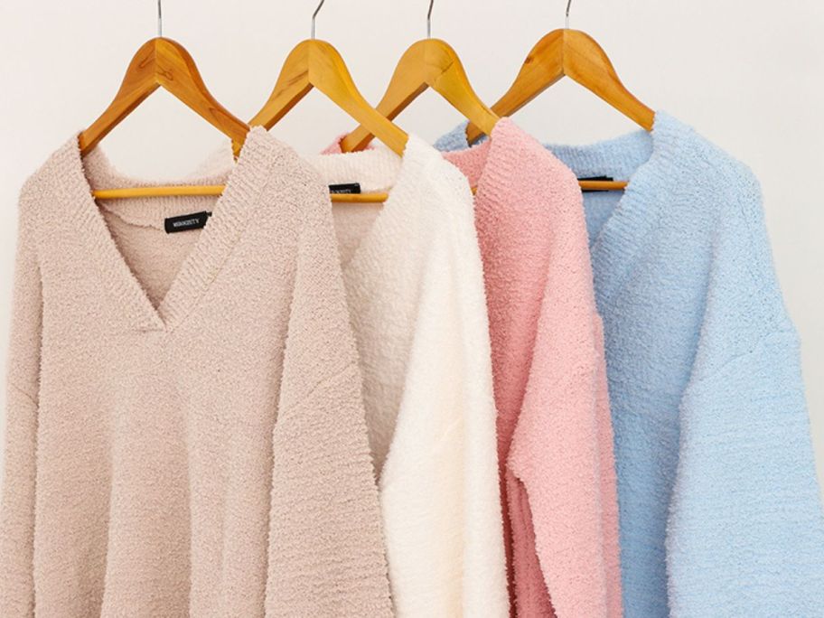 4 fuzzy shirts on hangers