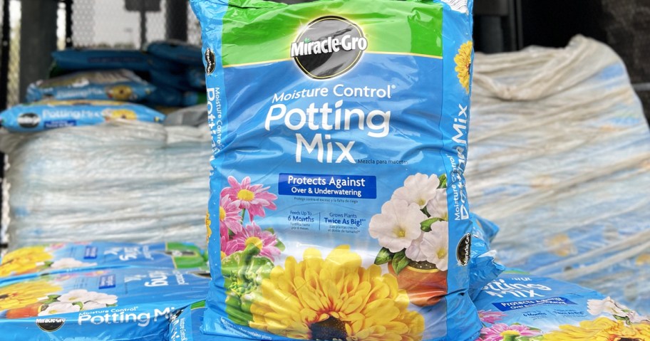 large blue bag of Miracle-Gro Potting Soil in garden center of hardware store