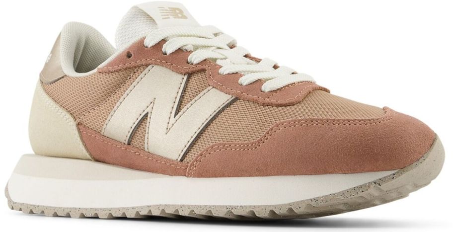 a womans copper colored new balance sneaker