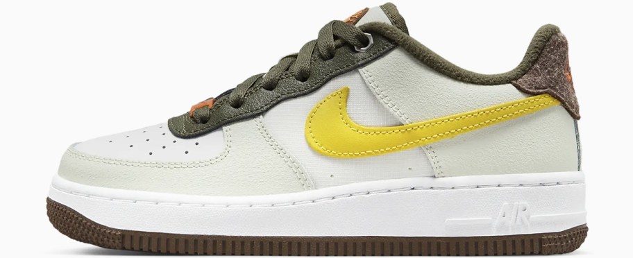 white, yellow, and brown nike sneaker