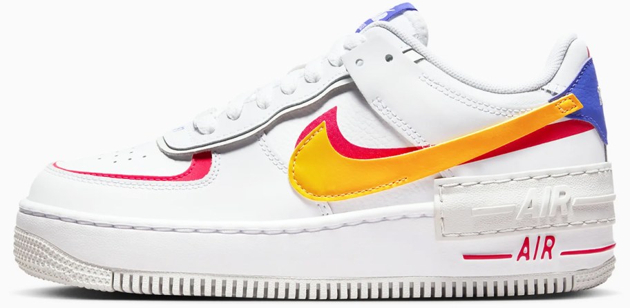 white, yellow, red, and blue nike sneaker