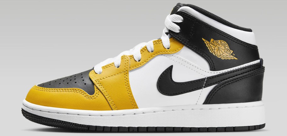 yellow, black and white kids Nike Jordan mid shoe