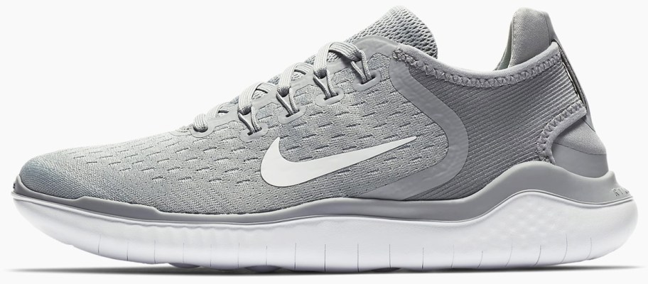 grey and white nike running shoe