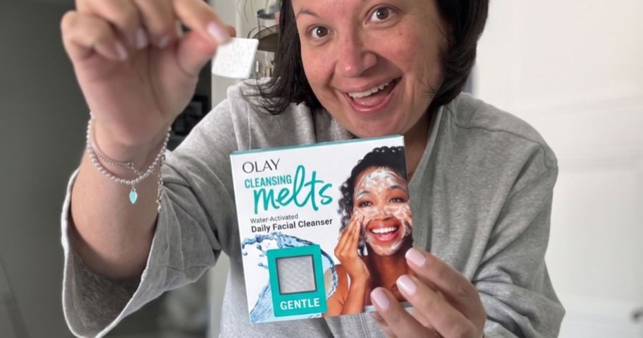 Lina holding Olay Cleansing Melts 32-Count in Unscented in bathroom