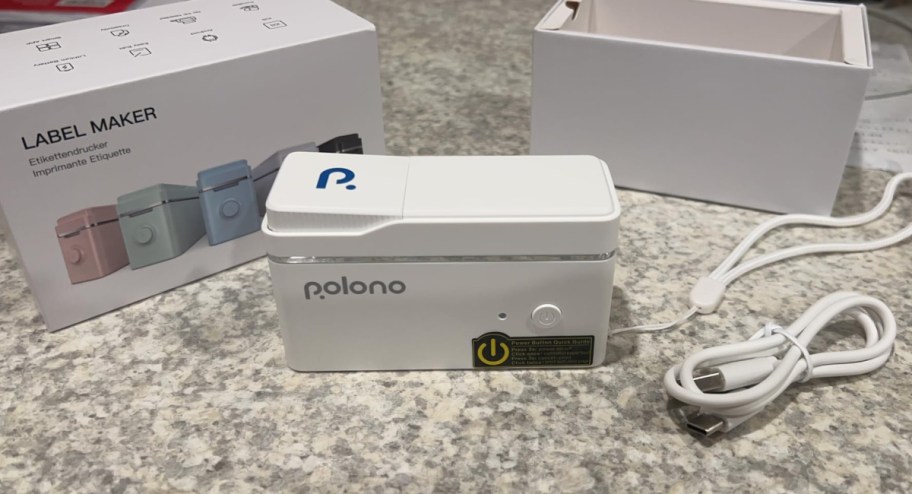 Polono label maker with box and wires beside it