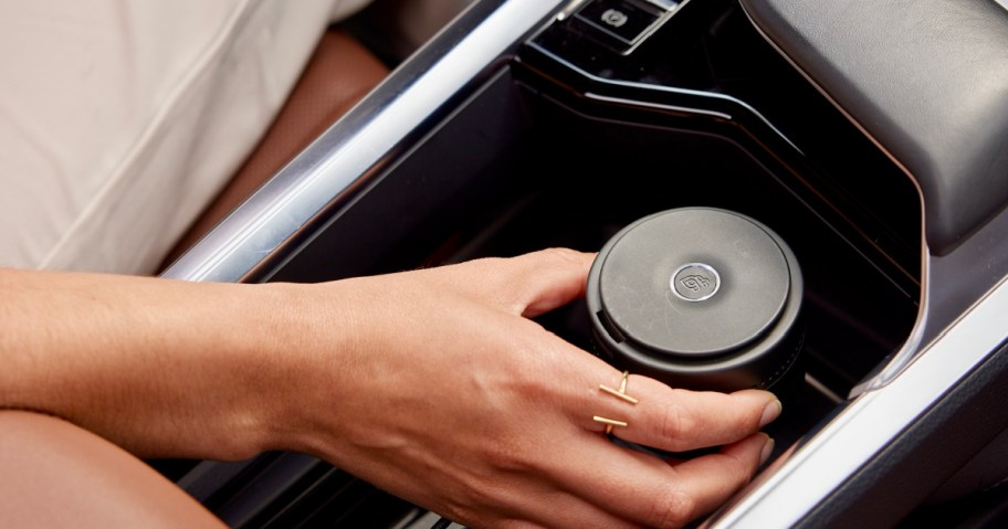 hand holding smart car fragrance diffuser 