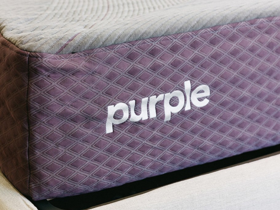 corner of purple mattress