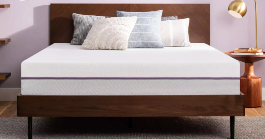 mattress on a wood bed frame