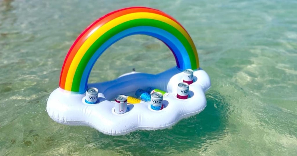 Rainbow Inflatable Cooler filled with drinks floating in ocean