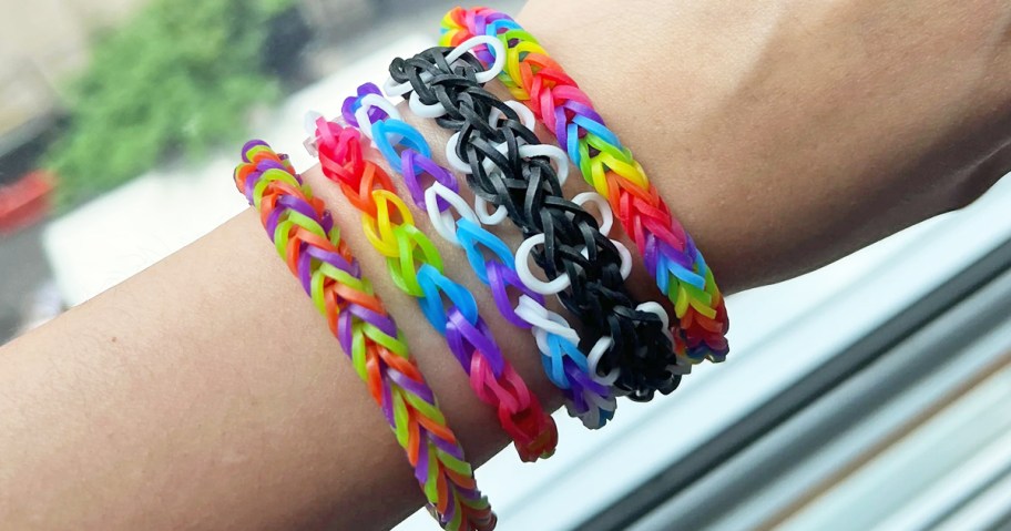 child wearing colorful rainbow loom bracelets