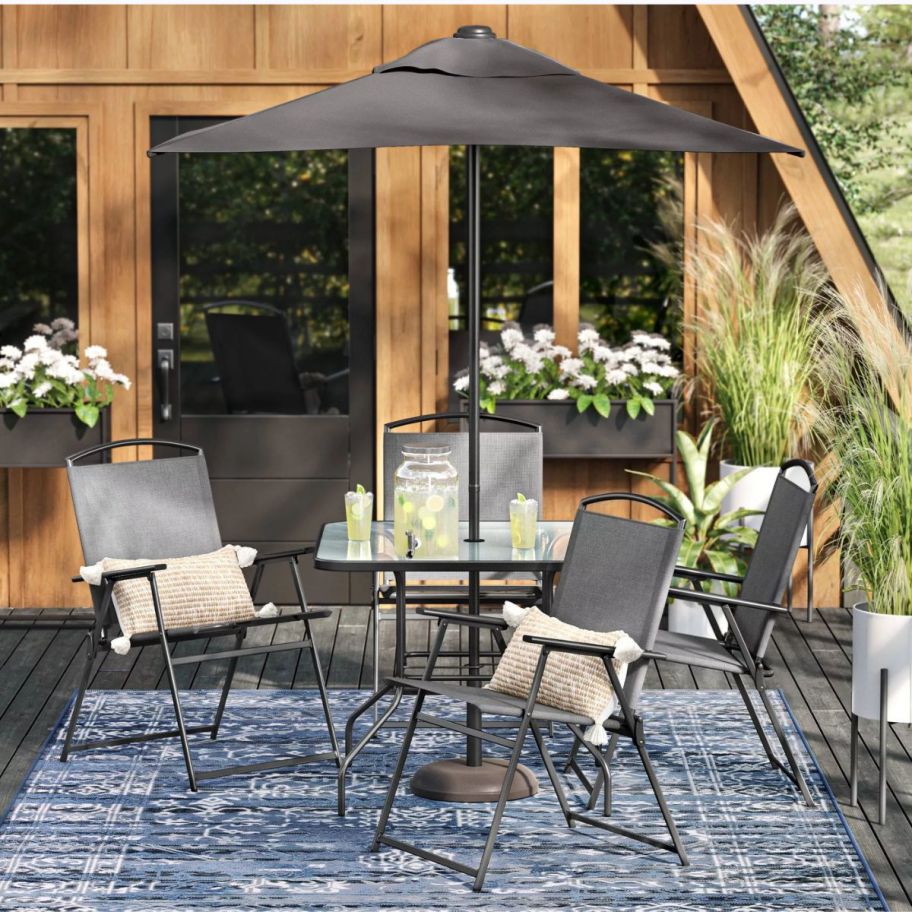 a 6 piece outdoor dining set on a patio