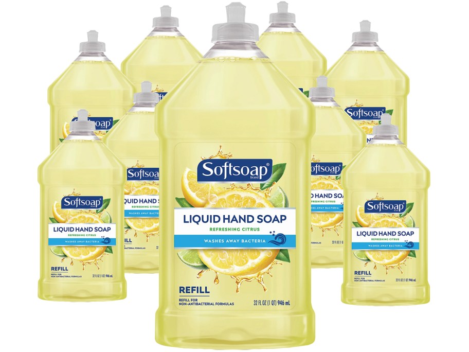 9 yellow bottles of softsoap hand soap refills