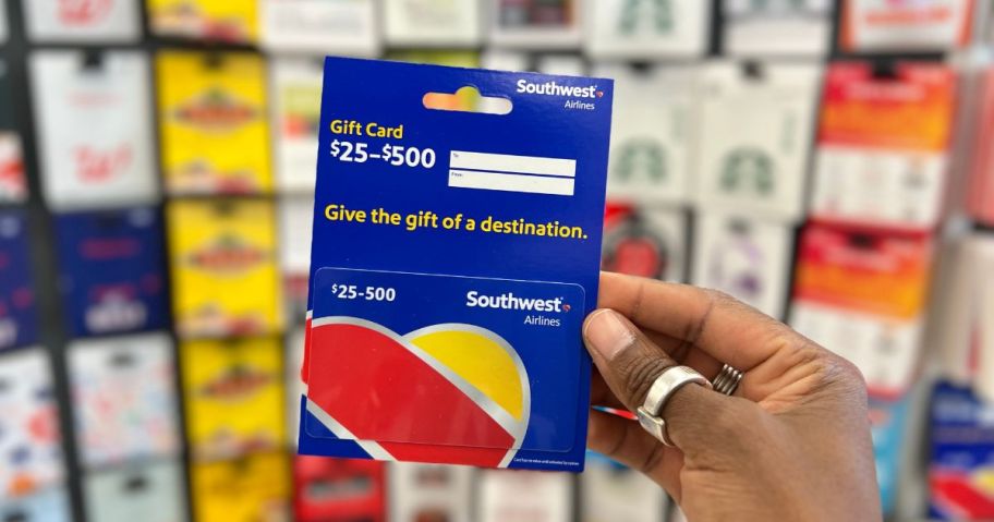 woman holding a southwest gift card