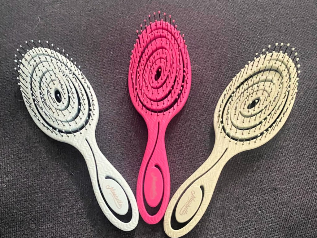 different colored spiral hair brushes