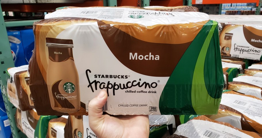 hand holding up case of Starbucks Mocha Frappuccinos in store